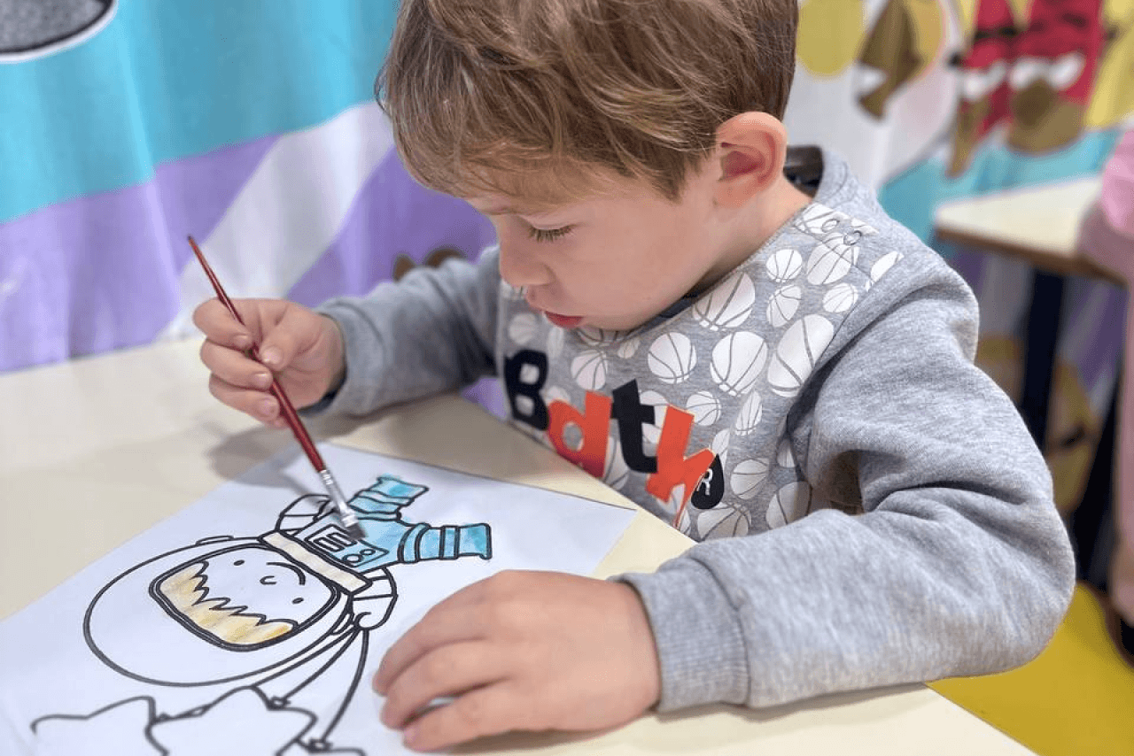 Preschool teacher working with a small group of children